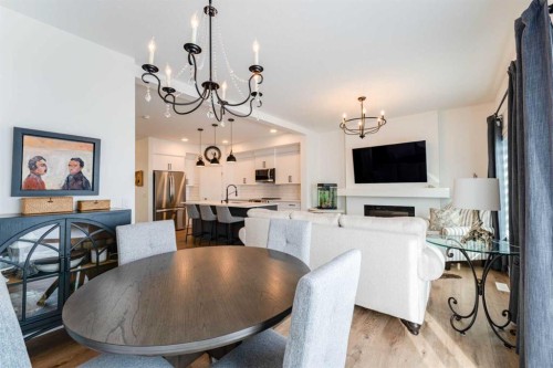 244 Heritage Heights, Cochrane, AB - Indoor Photo Showing Dining Room With Fireplace