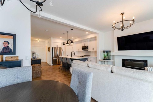 244 Heritage Heights, Cochrane, AB - Indoor Photo Showing Living Room With Fireplace