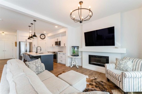 244 Heritage Heights, Cochrane, AB - Indoor Photo Showing Living Room With Fireplace