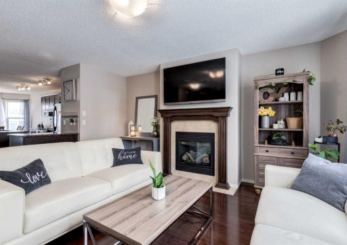 38 Autumn Crescent Se, Calgary, AB - Indoor Photo Showing Living Room With Fireplace