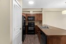 212-10 Panatella Road Nw, Calgary, AB  - Indoor Photo Showing Kitchen With Double Sink 