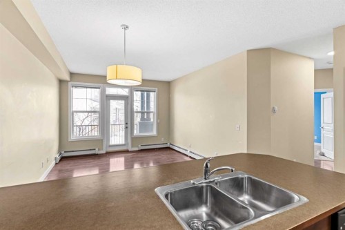 212-10 Panatella Road Nw, Calgary, AB - Indoor Photo Showing Kitchen With Double Sink
