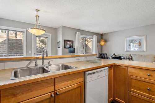 18 Hidden Creek Rise Nw, Calgary, AB - Indoor Photo Showing Kitchen With Double Sink