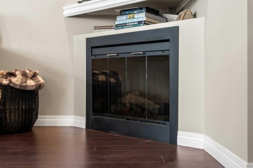 18 Hidden Creek Rise Nw, Calgary, AB - Indoor Photo Showing Other Room With Fireplace