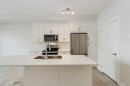 107-500 Auburn Meadows Common Se, Calgary, AB  - Indoor Photo Showing Kitchen With Stainless Steel Kitchen With Upgraded Kitchen 