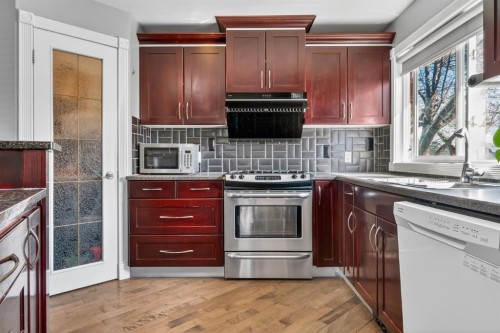 1027 75 Avenue Sw, Calgary, AB - Indoor Photo Showing Kitchen With Double Sink