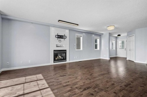 37 Evansbrooke Park Nw, Calgary, AB - Indoor Photo Showing Other Room With Fireplace