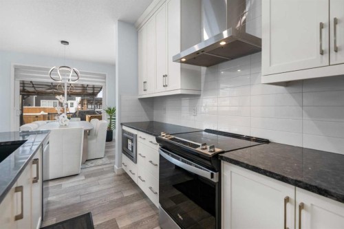 158 Magnolia Path Se, Calgary, AB - Indoor Photo Showing Kitchen With Upgraded Kitchen