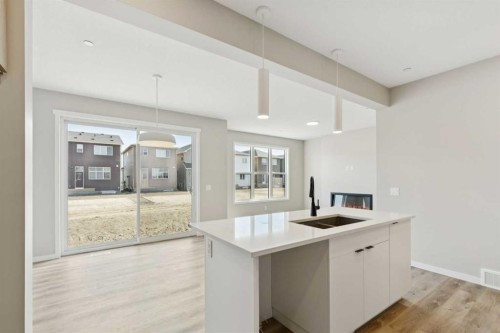 302 Hotchkiss Common Se, Calgary, AB - Indoor Photo Showing Kitchen With Double Sink