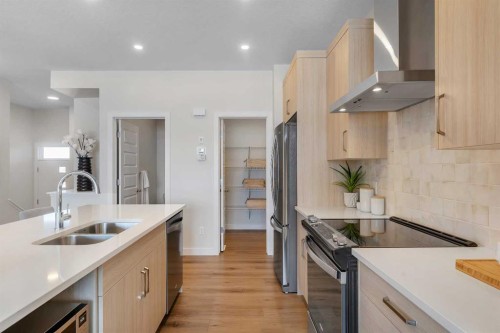 434 South Shore Drive, Chestermere, AB - Indoor Photo Showing Kitchen With Stainless Steel Kitchen With Double Sink With Upgraded Kitchen