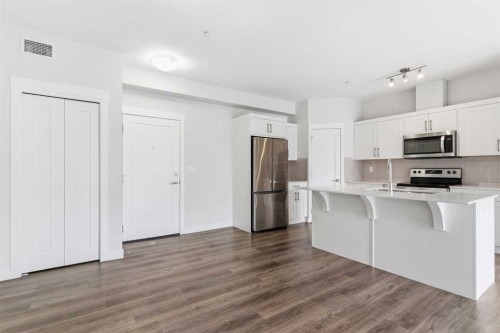 211-25 Walgrove Walk Se, Calgary, AB - Indoor Photo Showing Kitchen With Stainless Steel Kitchen