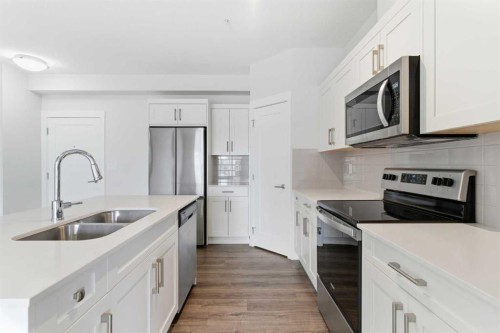 211-25 Walgrove Walk Se, Calgary, AB - Indoor Photo Showing Kitchen With Stainless Steel Kitchen With Double Sink With Upgraded Kitchen