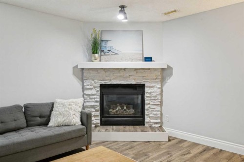 225 Somerset Drive Sw, Calgary, AB - Indoor Photo Showing Living Room With Fireplace