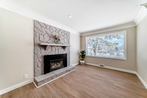 2007 Cottonwood Crescent Se, Calgary, AB - Indoor Photo Showing Living Room With Fireplace