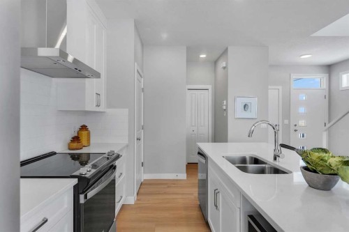 390 South Shore Drive, Chestermere, AB - Indoor Photo Showing Kitchen With Double Sink With Upgraded Kitchen