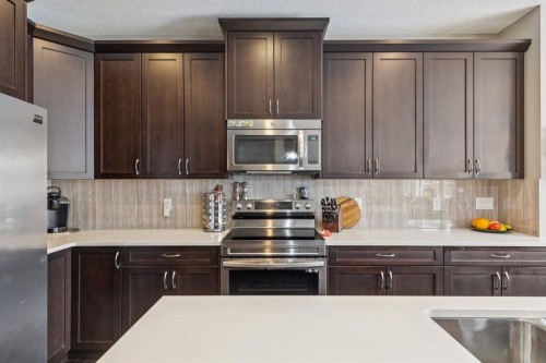 7 Cooperstown Place Sw, Airdrie, AB - Indoor Photo Showing Kitchen With Double Sink With Upgraded Kitchen