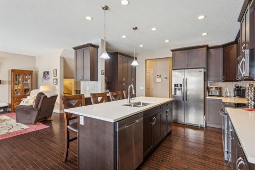 7 Cooperstown Place Sw, Airdrie, AB - Indoor Photo Showing Kitchen With Double Sink With Upgraded Kitchen