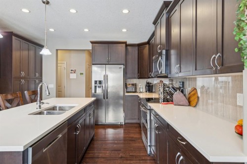 7 Cooperstown Place Sw, Airdrie, AB - Indoor Photo Showing Kitchen With Double Sink With Upgraded Kitchen