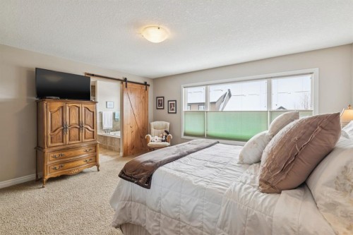 7 Cooperstown Place Sw, Airdrie, AB - Indoor Photo Showing Bedroom
