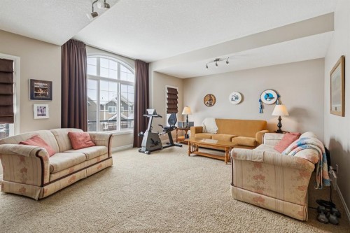 7 Cooperstown Place Sw, Airdrie, AB - Indoor Photo Showing Living Room