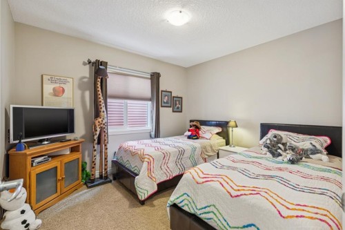 7 Cooperstown Place Sw, Airdrie, AB - Indoor Photo Showing Bedroom