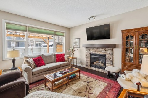 7 Cooperstown Place Sw, Airdrie, AB - Indoor Photo Showing Living Room With Fireplace