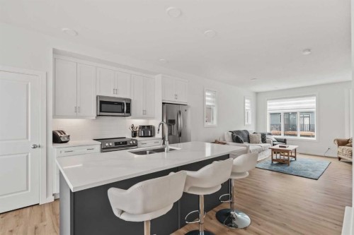 86 Spring Willow Close Sw, Calgary, AB - Indoor Photo Showing Kitchen With Stainless Steel Kitchen With Double Sink With Upgraded Kitchen