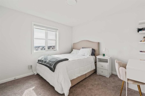 86 Spring Willow Close Sw, Calgary, AB - Indoor Photo Showing Bedroom