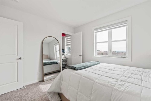 86 Spring Willow Close Sw, Calgary, AB - Indoor Photo Showing Bedroom