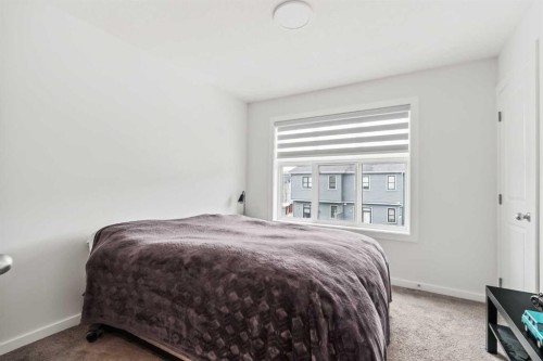 86 Spring Willow Close Sw, Calgary, AB - Indoor Photo Showing Bedroom