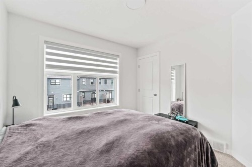 86 Spring Willow Close Sw, Calgary, AB - Indoor Photo Showing Bedroom