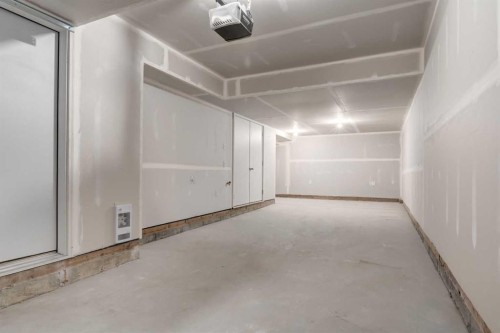 86 Spring Willow Close Sw, Calgary, AB - Indoor Photo Showing Garage