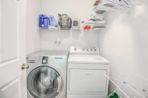 207 Crystalridge Place, Okotoks, AB - Indoor Photo Showing Laundry Room