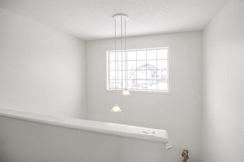 207 Crystalridge Place, Okotoks, AB - Indoor Photo Showing Other Room