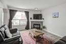 207 Crystalridge Place, Okotoks, AB  - Indoor Photo Showing Living Room With Fireplace 
