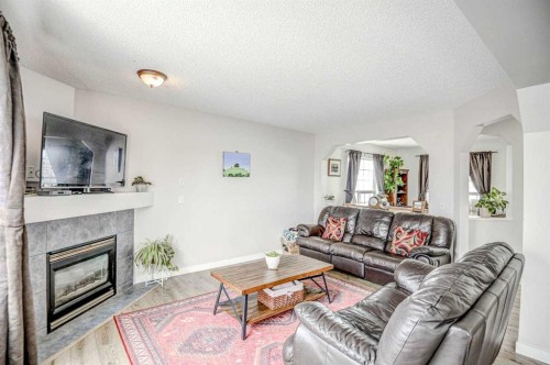 207 Crystalridge Place, Okotoks, AB - Indoor Photo Showing Living Room With Fireplace