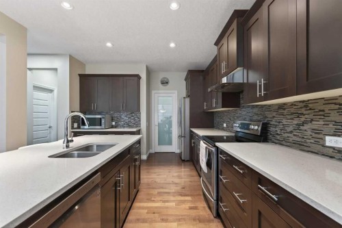 673 Marina Drive, Chestermere, AB - Indoor Photo Showing Kitchen With Double Sink With Upgraded Kitchen