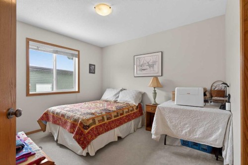 38 Tanner Close Se, Airdrie, AB - Indoor Photo Showing Bedroom