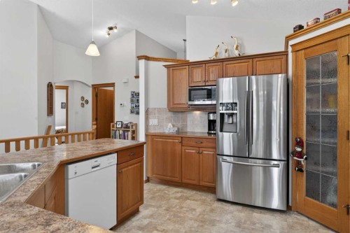 38 Tanner Close Se, Airdrie, AB - Indoor Photo Showing Kitchen With Stainless Steel Kitchen With Double Sink With Upgraded Kitchen