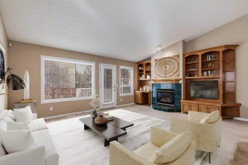 17 Rocky Ridge Villas Nw, Calgary, AB - Indoor Photo Showing Living Room With Fireplace