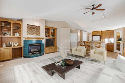 17 Rocky Ridge Villas Nw, Calgary, AB - Indoor Photo Showing Living Room With Fireplace