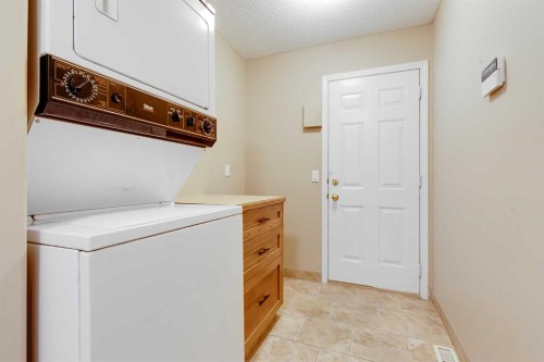 17 Rocky Ridge Villas Nw, Calgary, AB - Indoor Photo Showing Laundry Room