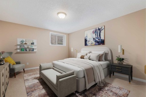 17 Rocky Ridge Villas Nw, Calgary, AB - Indoor Photo Showing Bedroom