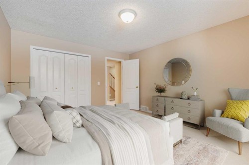 17 Rocky Ridge Villas Nw, Calgary, AB - Indoor Photo Showing Bedroom