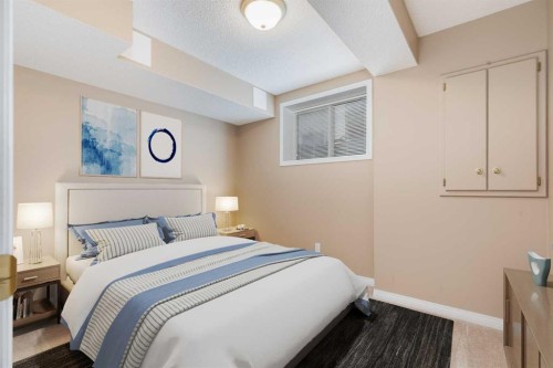 17 Rocky Ridge Villas Nw, Calgary, AB - Indoor Photo Showing Bedroom