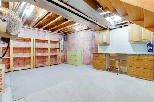 17 Rocky Ridge Villas Nw, Calgary, AB - Indoor Photo Showing Basement