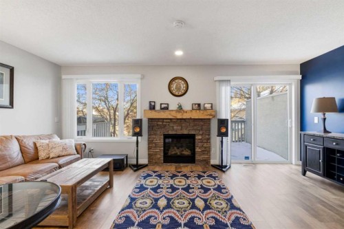 85 Cedarview Mews Sw, Calgary, AB - Indoor Photo Showing Living Room With Fireplace