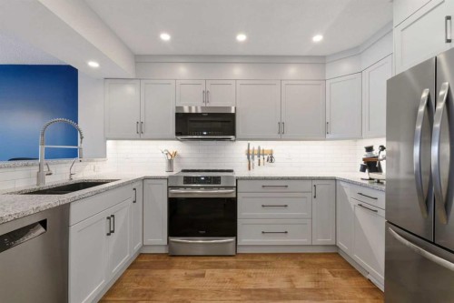 85 Cedarview Mews Sw, Calgary, AB - Indoor Photo Showing Kitchen With Stainless Steel Kitchen With Upgraded Kitchen