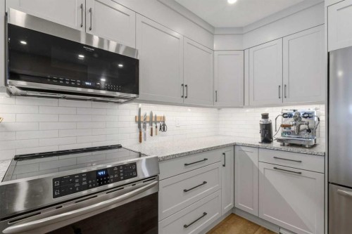 85 Cedarview Mews Sw, Calgary, AB - Indoor Photo Showing Kitchen With Stainless Steel Kitchen With Upgraded Kitchen