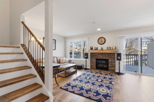 85 Cedarview Mews Sw, Calgary, AB - Indoor Photo Showing Living Room With Fireplace